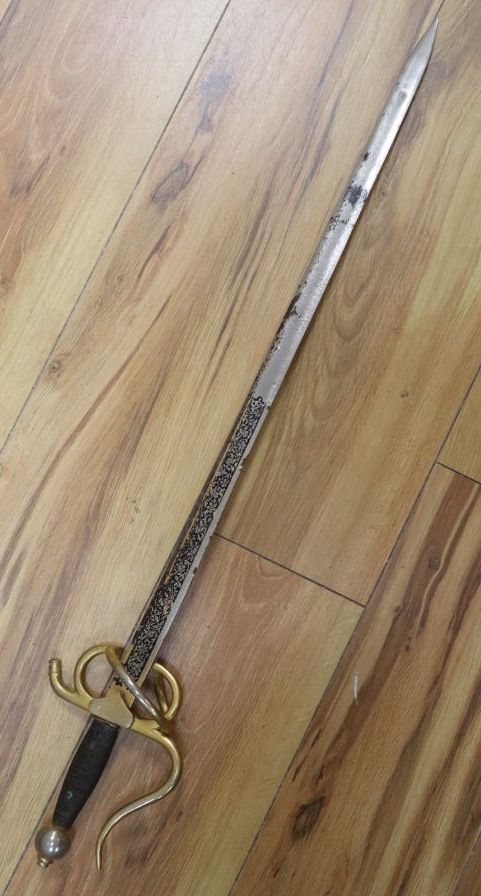 An officers sword with cast hilt and etched, 61cm double-edged blade